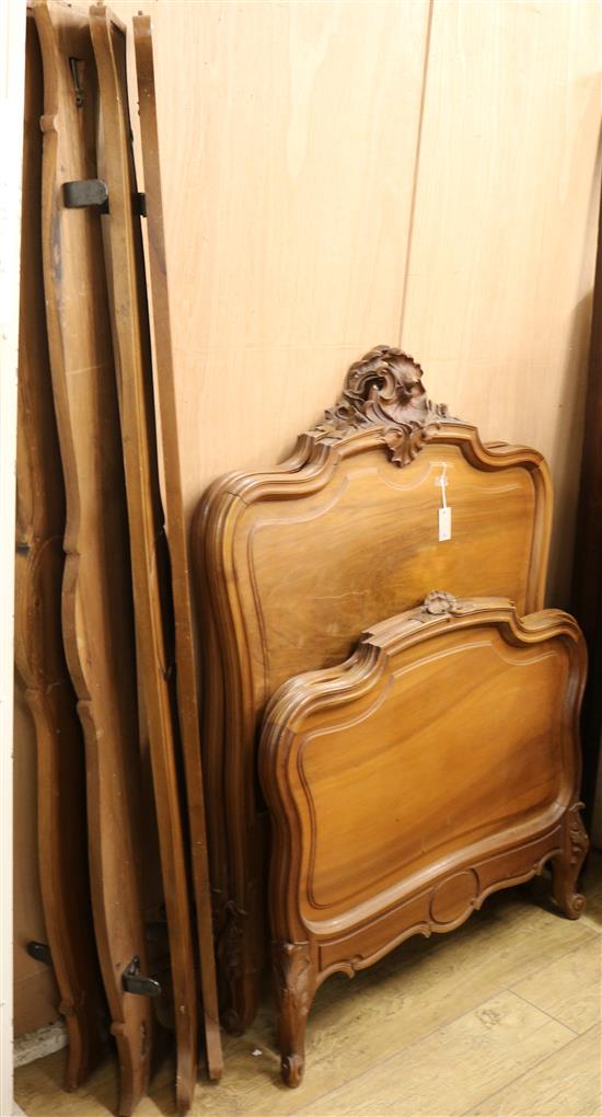 A pair of French walnut single bedsteads W.99cm approx.